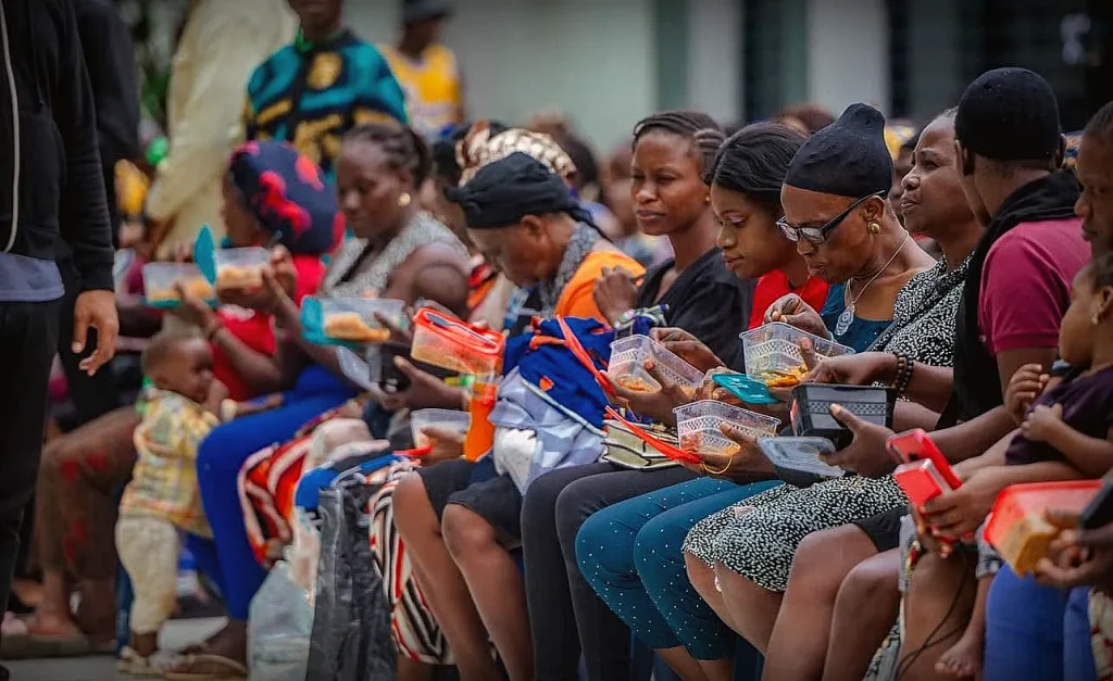 Community members receiving food at a OneSound Charity Open Pantry Day