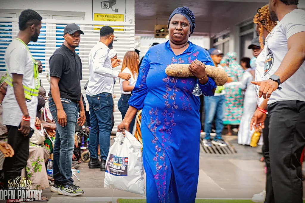 A community member receiving food aid at a OneSound Charity event